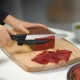 Кухонний ніж Victorinox SwissClassic DUX лезо 21см хвил. з направляючою з чорн. ручкою